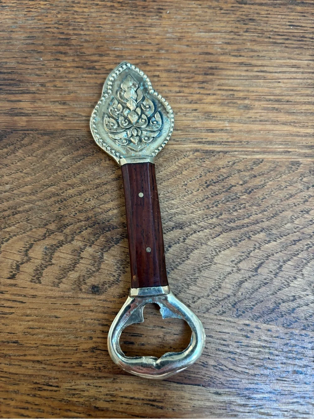 Vintage Brass and Wood Bottle Opener. Bottle Embossed Hindu Deity Design.